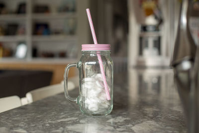 Close-up of drink in glass jar on table