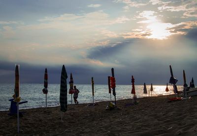 Scenic view of beach against sky during sunset