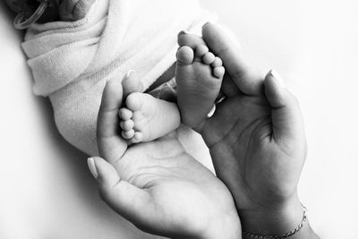 Close-up of hand against white background