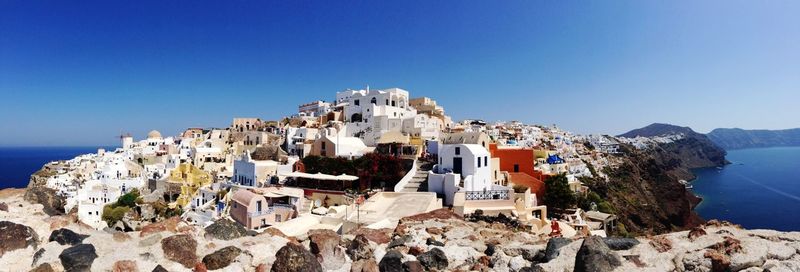 Panoramic view of sea against clear blue sky