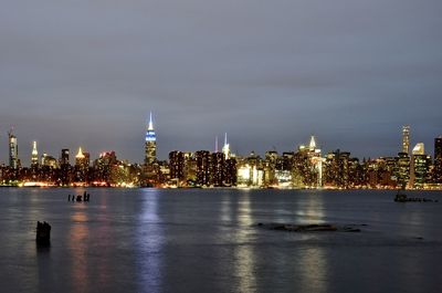 Illuminated cityscape with waterfront