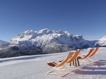 Chairs on a ski run in the alps