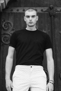 Portrait of young man standing outdoors