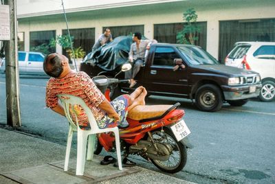 Man riding bicycle on street