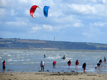 People surfing on beach