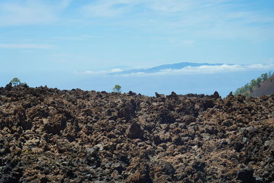 Low angle view of rock formations against sky