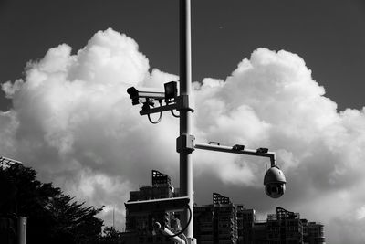 Low angle view of street light against sky