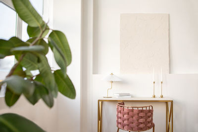 Table with lamp and books in studio