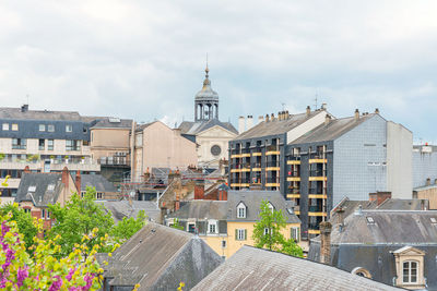 Buildings in city against sky