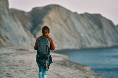 Rear view of woman looking at sea