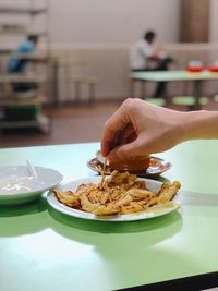 Close-up of hand holding food