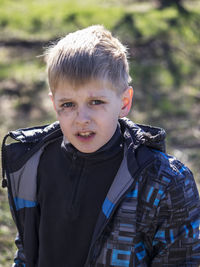 Portrait of boy with soot smear on face