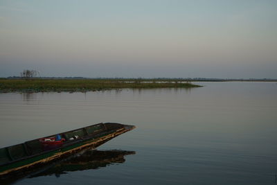 Scenic view of lake against sky during sunset