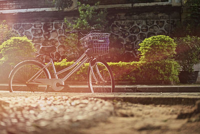 Bicycle parked against wall