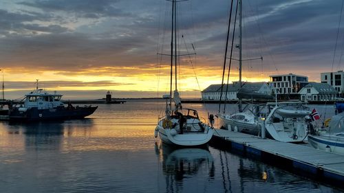 Boats moored at harbor