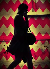 Close-up of woman standing on tiled floor