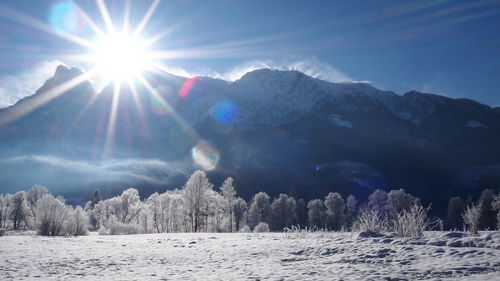 Scenic view of snow covered mountains against sky