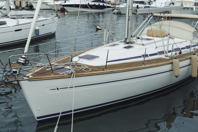 Yacht moored in water at harbor