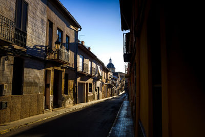 Narrow alley amidst buildings in city