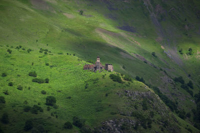 High angle view of people on field against mountain