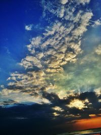 Scenic view of landscape against sky at sunset