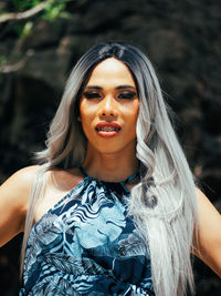 Portrait of smiling young trans woman