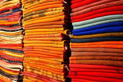 Full frame shot of colorful stacked textiles for sale at store