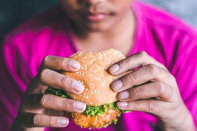 Close-up of man eating food