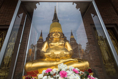 Low angle view of statue against building