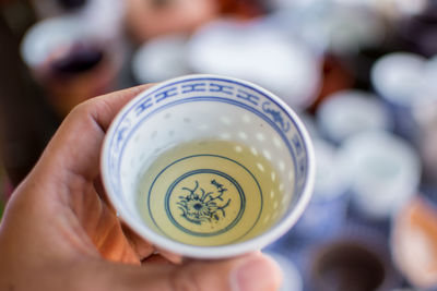 Directly above shot of person holding tea cup