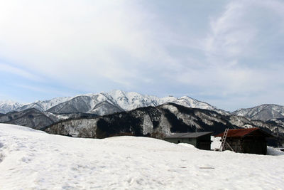 Scenic view of snowcapped mountains against sky