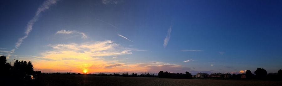 Scenic view of landscape against sky at sunset