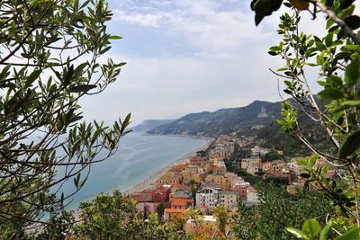 Townscape by sea against sky