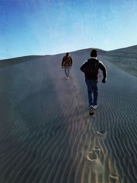 People running on sand