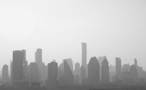 Modern cityscape against clear sky
