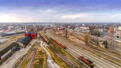 High angle view of train in city against sky