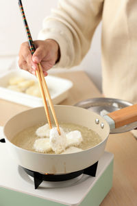 Midsection of man preparing food