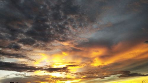 Low angle view of dramatic sky during sunset