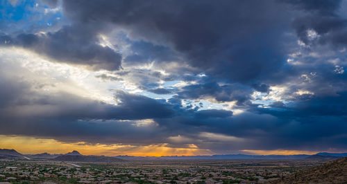 Scenic view of dramatic sky over land