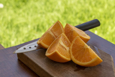 Close-up of orange slice on cutting board