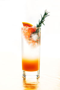 Close-up of beer glass against white background