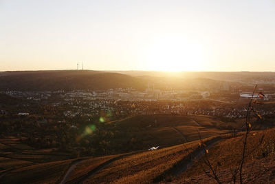 Aerial view of townscape against sky during sunset