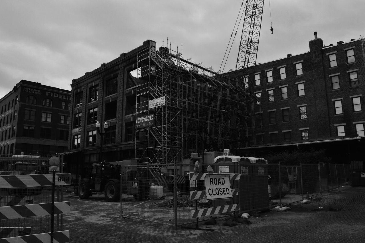 building exterior, architecture, built structure, sky, city, building, cloud - sky, day, street, outdoors, residential building, no people, residential structure, transportation, low angle view, construction site, abandoned, cloud, road, cloudy