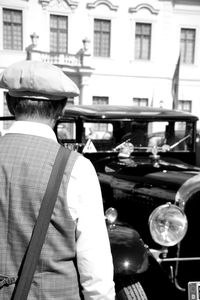 Rear view of a man standing in city