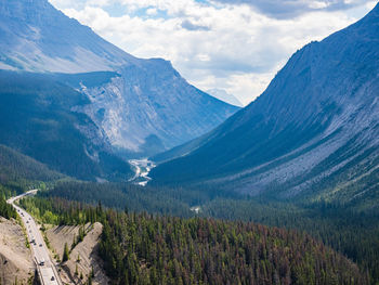 Scenic view of mountains against sky with icefields parkway road