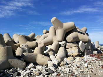 View of stone wall against cloudy sky