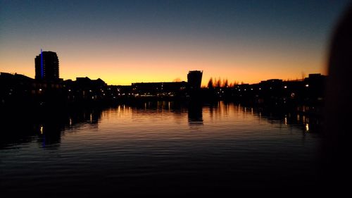 Silhouette of city at sunset