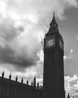 Low angle view of clock tower against sky