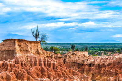 View of tatacoa desert against cloudy sky