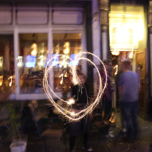 Blurred motion of illuminated lighting equipment at night